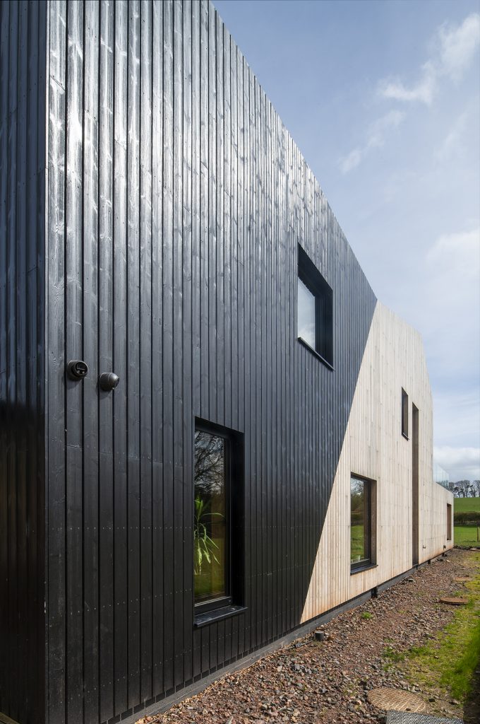 Black coated Thermopine with contrasting lighter cladding on a home in Scotland.