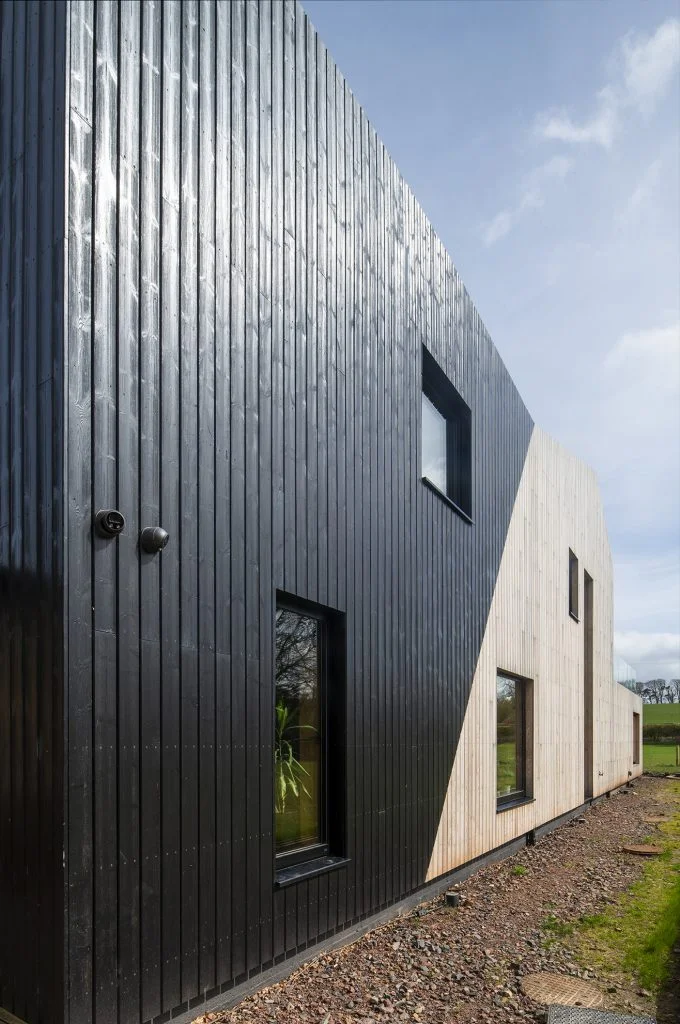 Two tone timber cladding design on Preston Mains project by Lewis and Hickey Architects using Thermopine timber coated black and SILA with SiOO:X
