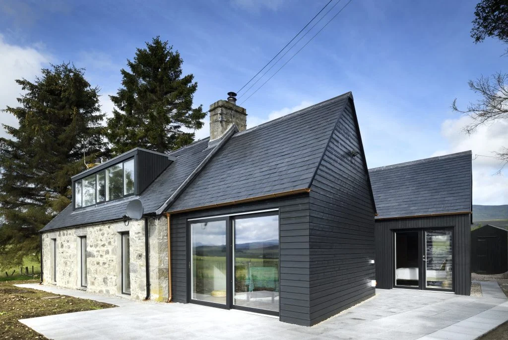 Strone Cottage in Newtonmore with black Thermopine cladding