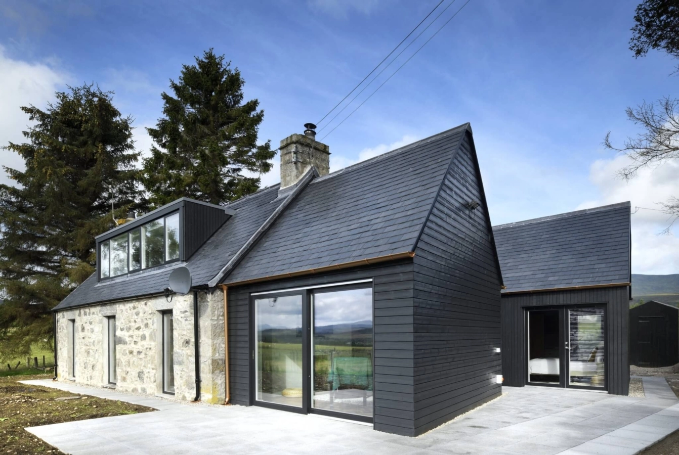 Strone Cottage in Newtonmore with black Thermopine cladding