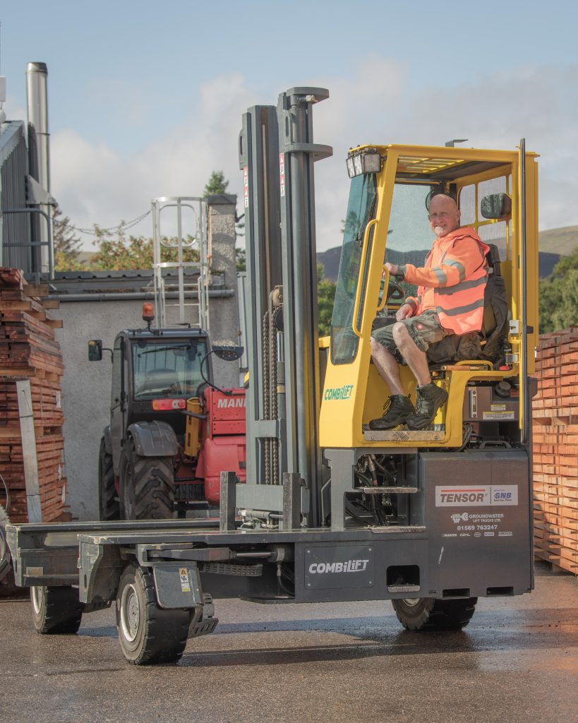 Andy hard at work in his electric forklift 