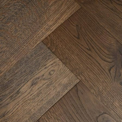 Grande Parquet Brushed Double Smoked Ebony Oak Flooring laid in a herringbone pattern