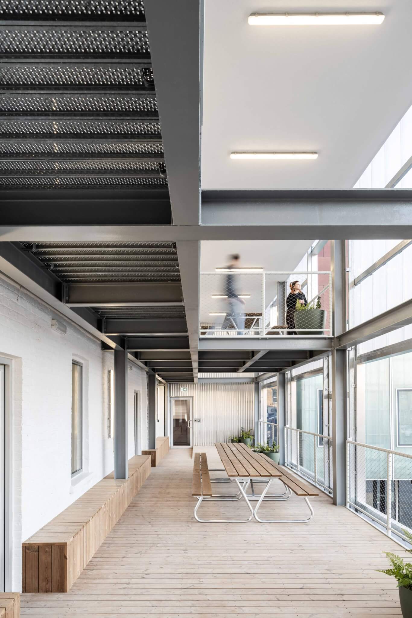 Timber decking and bench in a modern studio in London, Bradbury Works.