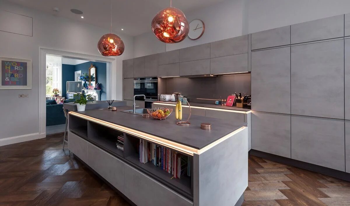 European Oak Flooring in Cinder laid in a herringbone arrangement in a kitchen with a large island.