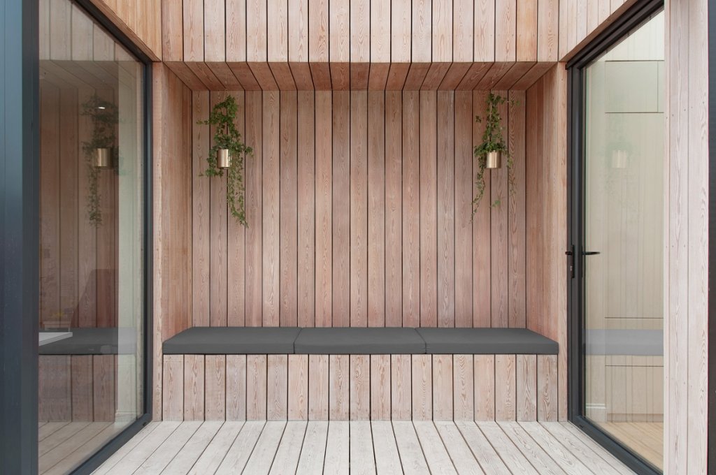 External wall feature with Siberian Larch (or SILA) cladding, factory coated with SiOO:X.