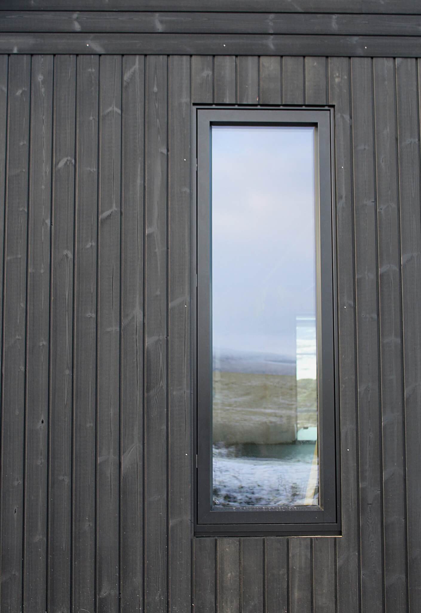 Thermopine® cladding factory coated with Woca Oil in Black