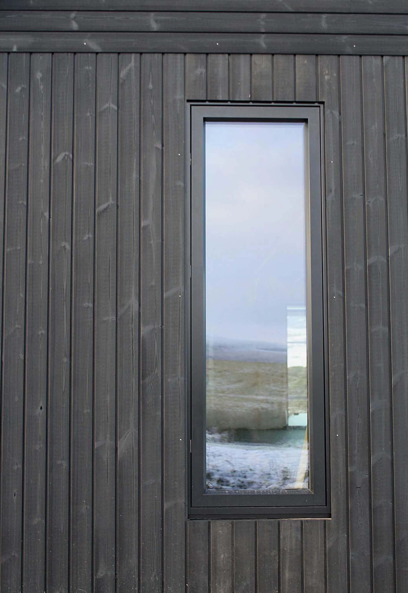 Thermopine® cladding factory coated with Woca Oil in Black