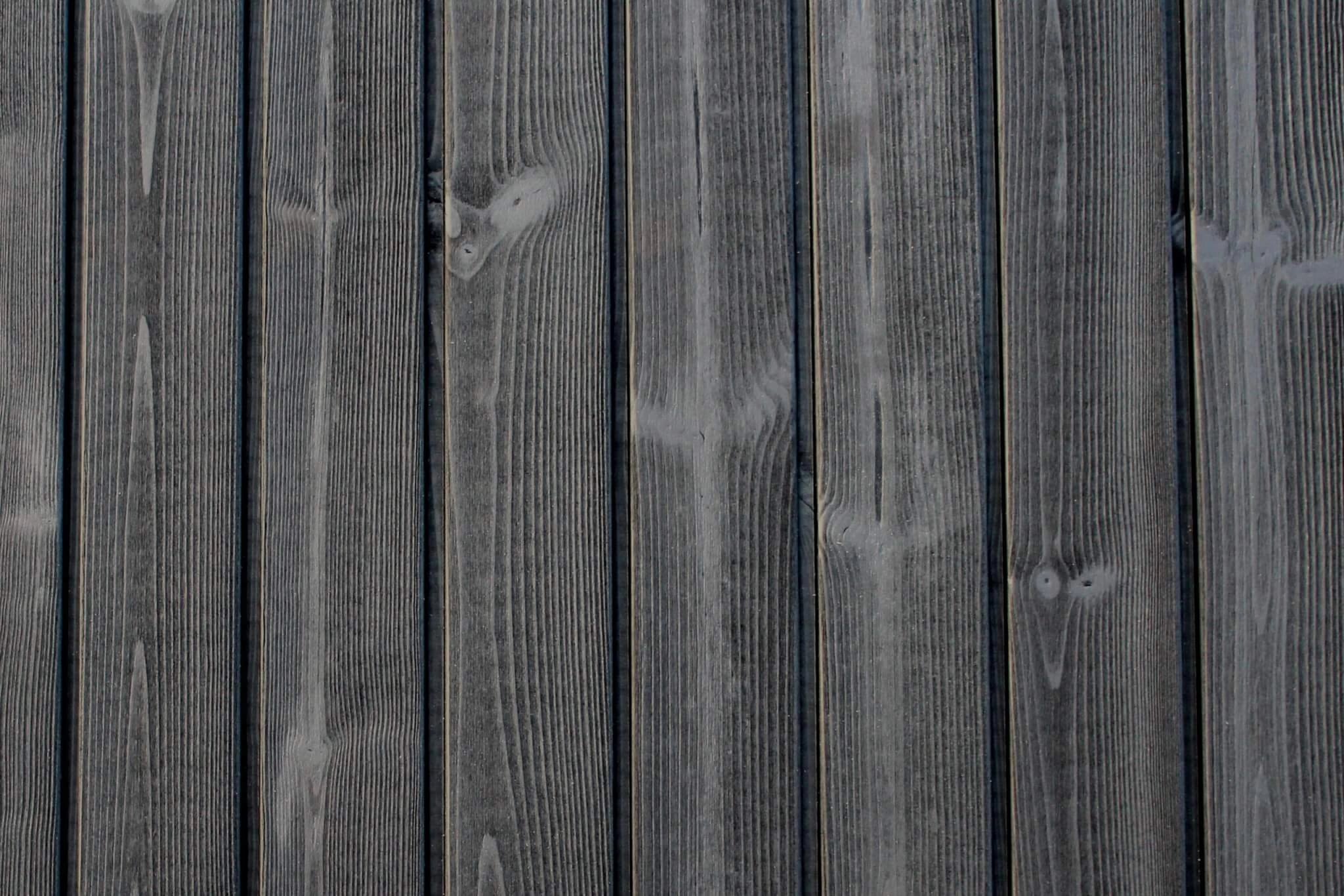 Thermopine® cladding factory coated with Woca Oil in Black