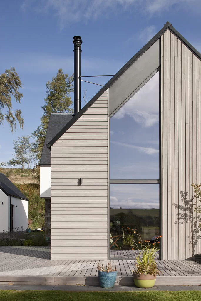 SILA Select® Siberian Larch factory coated with SiOO:X Mid Grey and VG SILA decking | Fiddes Architects | David Barbour Photography