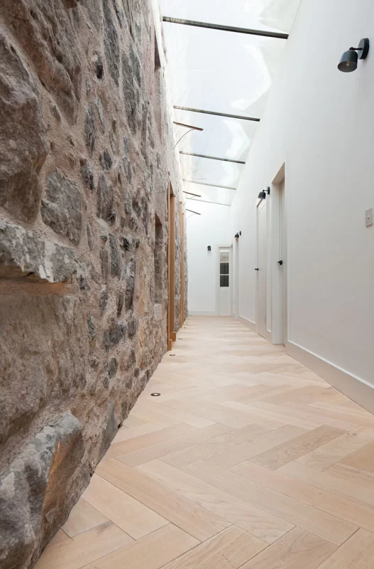 Russwood European Oak Flooring in Oat in a herringbone arrangement used in a project designed by Staran Architects.