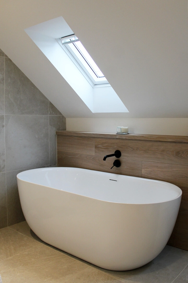 Russwood European Oak Flooring in Pearl used as interior wall cladding in a bathroom with a large white bathtub.