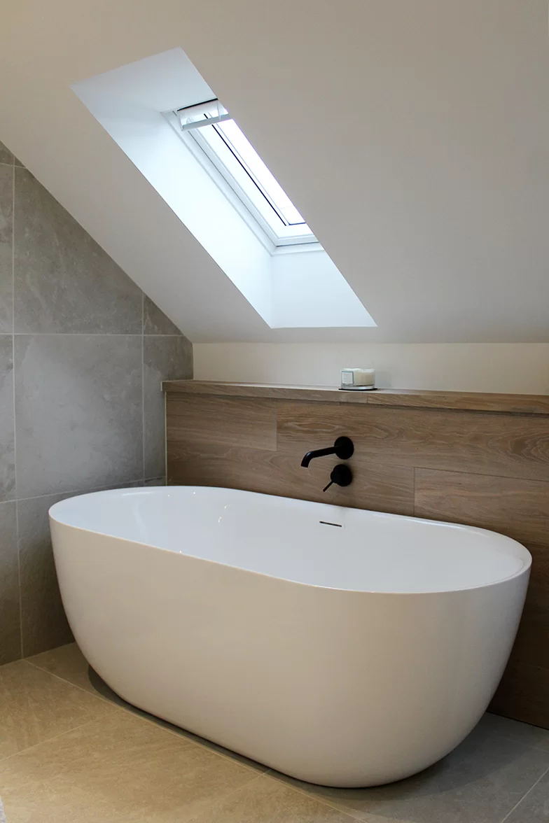 Russwood European Oak Flooring in Pearl used as interior wall cladding in a bathroom with a large white bathtub.