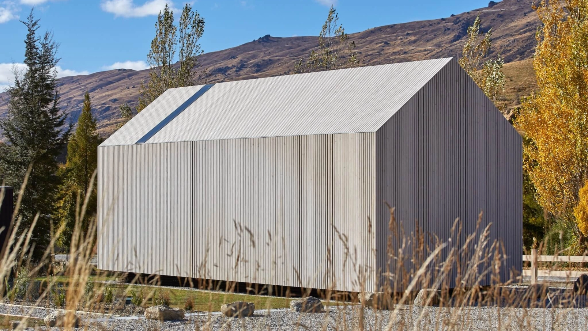 a cabin style building clad in Abodo Vulcan Vertical Grain cladding from Russwood in an open rainscreen arrangement