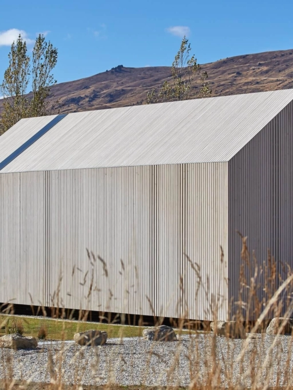 a cabin style building clad in Abodo Vulcan Vertical Grain cladding from Russwood in an open rainscreen arrangement