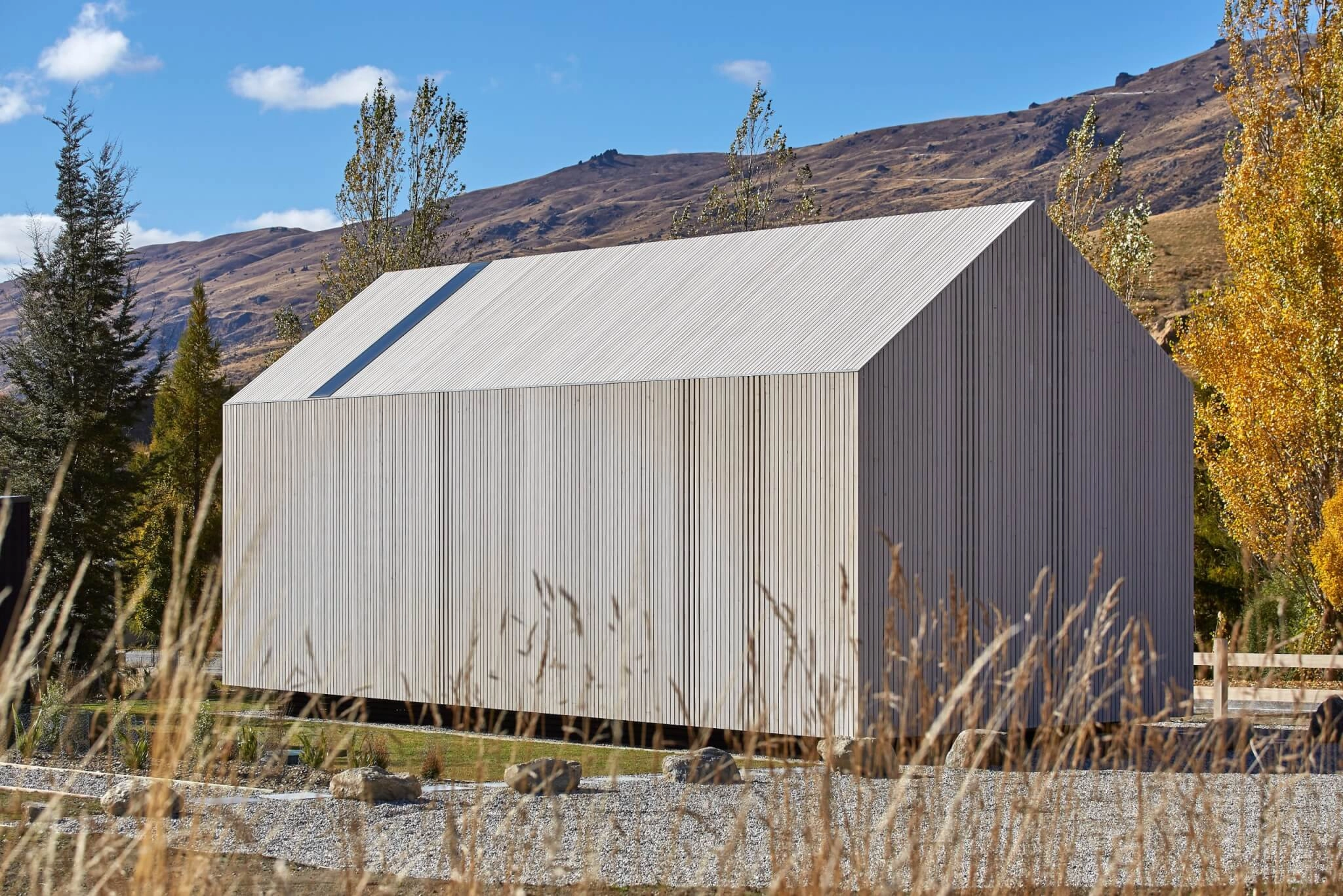 a cabin style building clad in Abodo Vulcan Vertical Grain cladding from Russwood in an open rainscreen arrangement