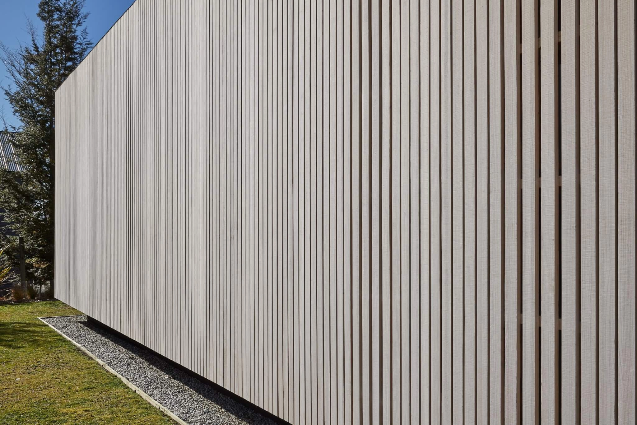 a cabin style building clad in Abodo Vulcan Vertical Grain cladding from Russwood in an open rainscreen arrangement