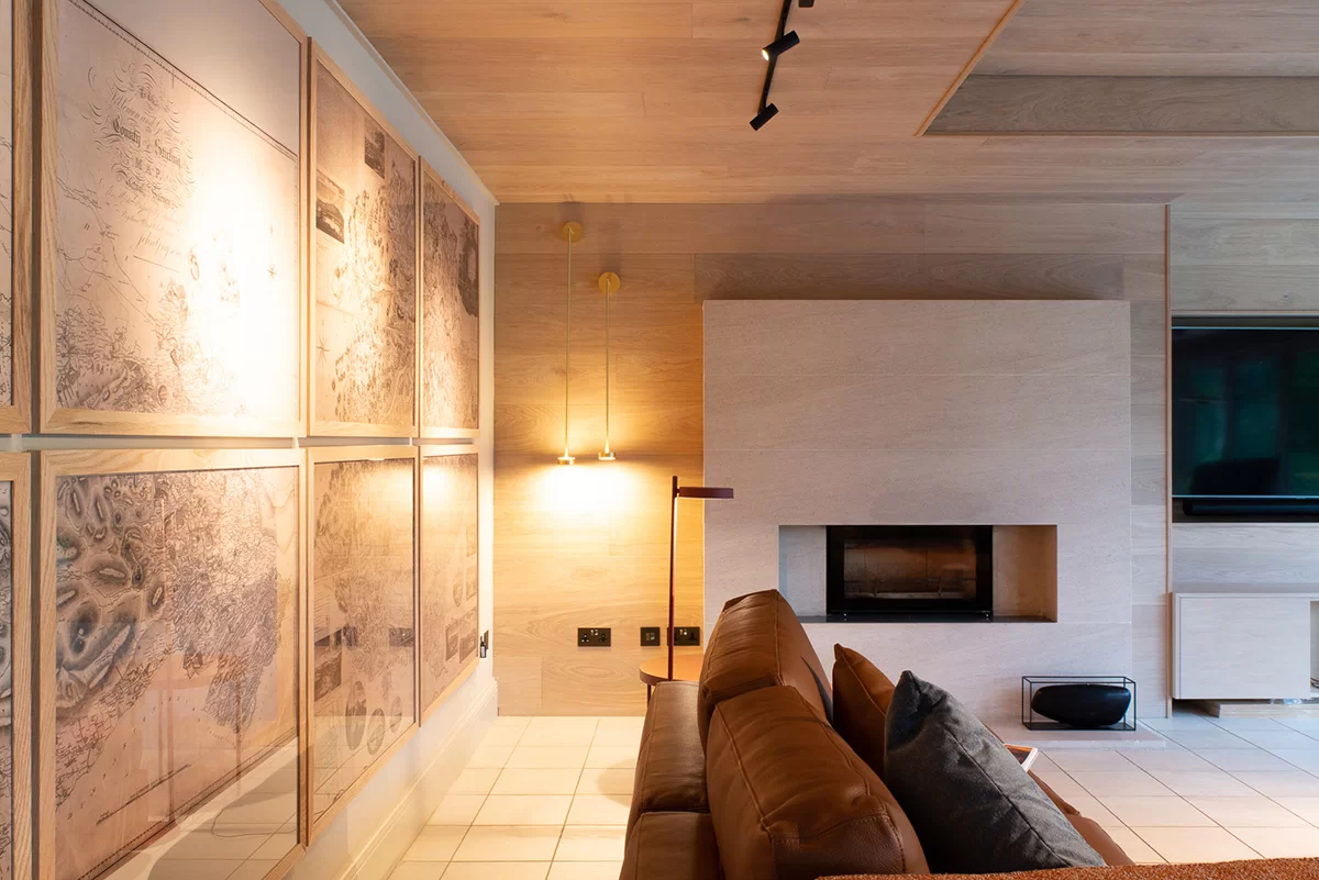 European Oak Flooring in Chalk used as interior wall cladding in a cosy living room.