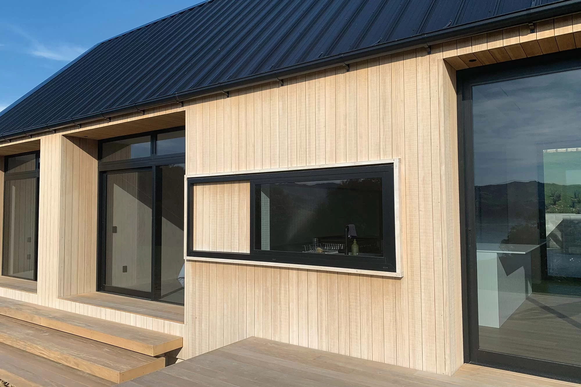 Abodo cladding coated with SiOO:X on house project