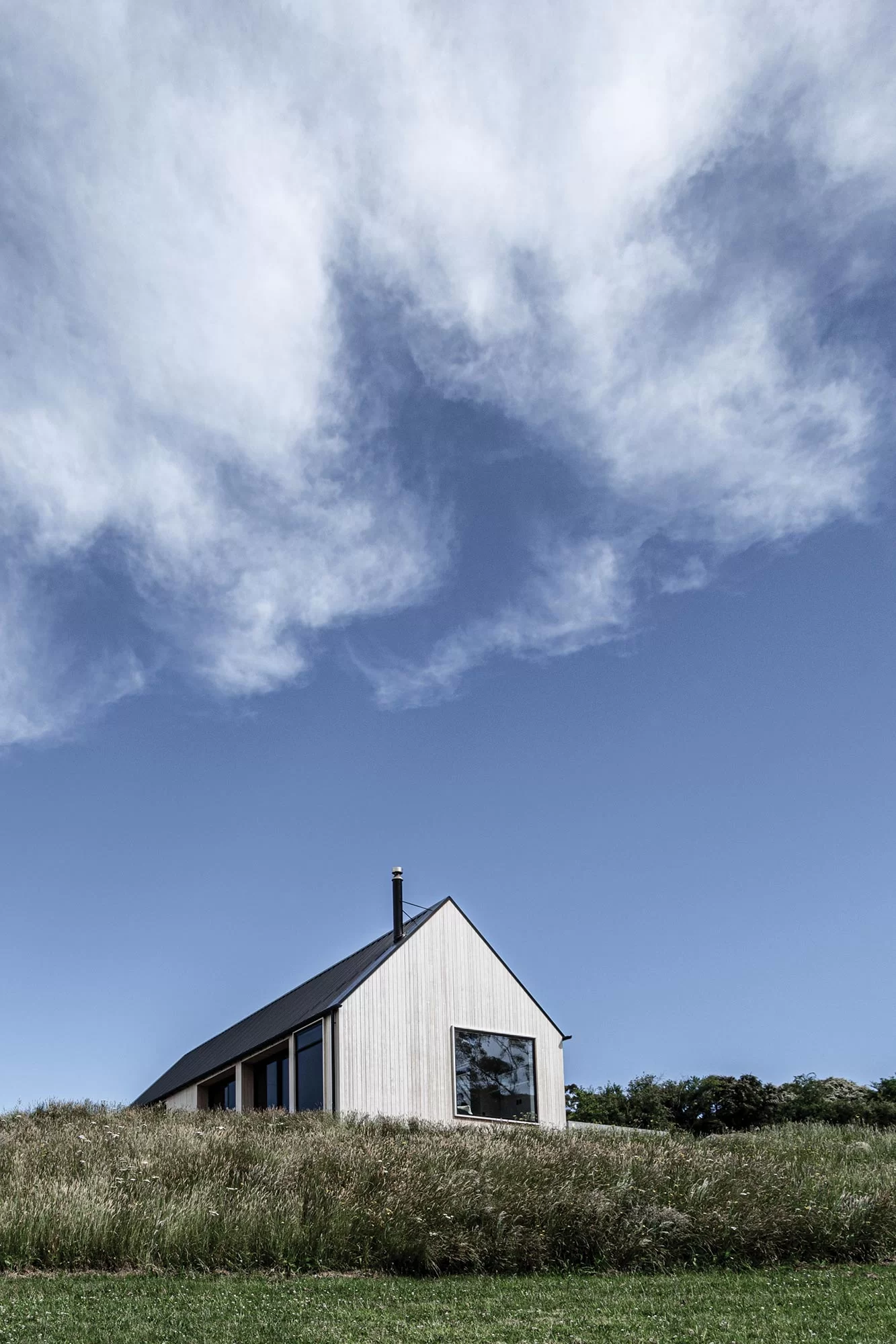 Domestic house with Abodo Vulcan Vertical Grain cladding with SiOO:X