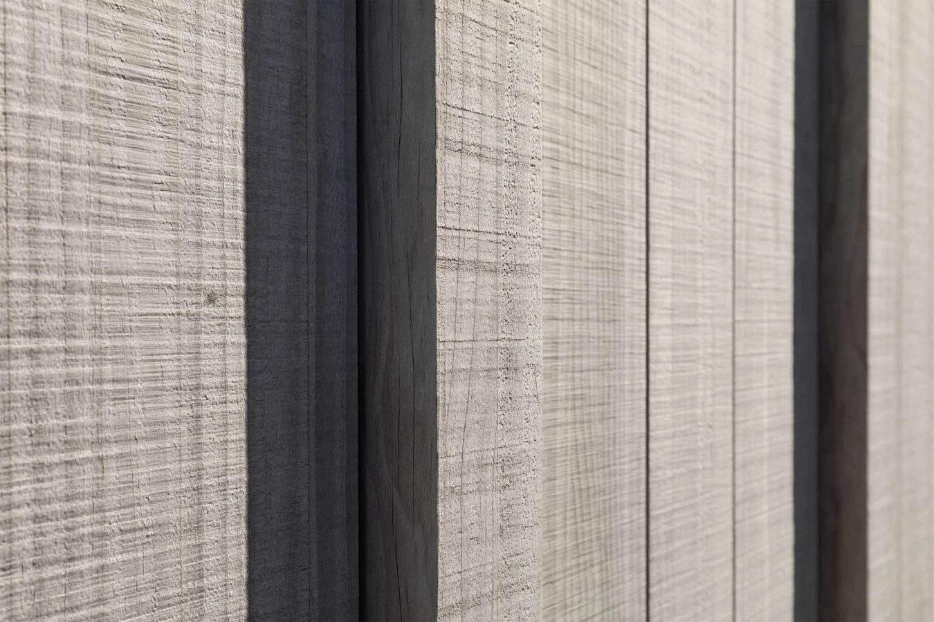 a cabin style building clad in Abodo Vulcan Vertical Grain cladding from Russwood in an open rainscreen