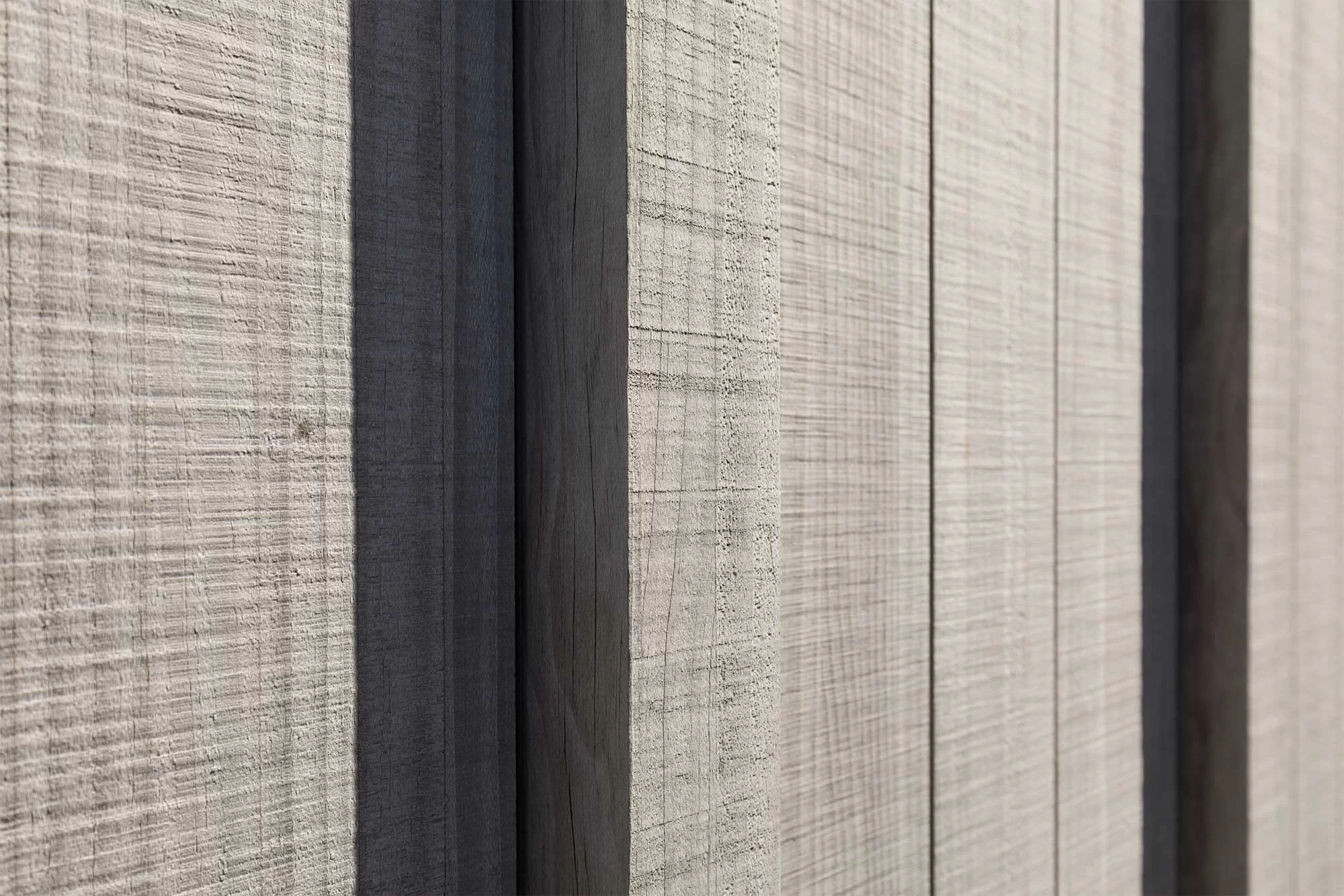 a cabin style building clad in Abodo Vulcan Vertical Grain cladding from Russwood in an open rainscreen