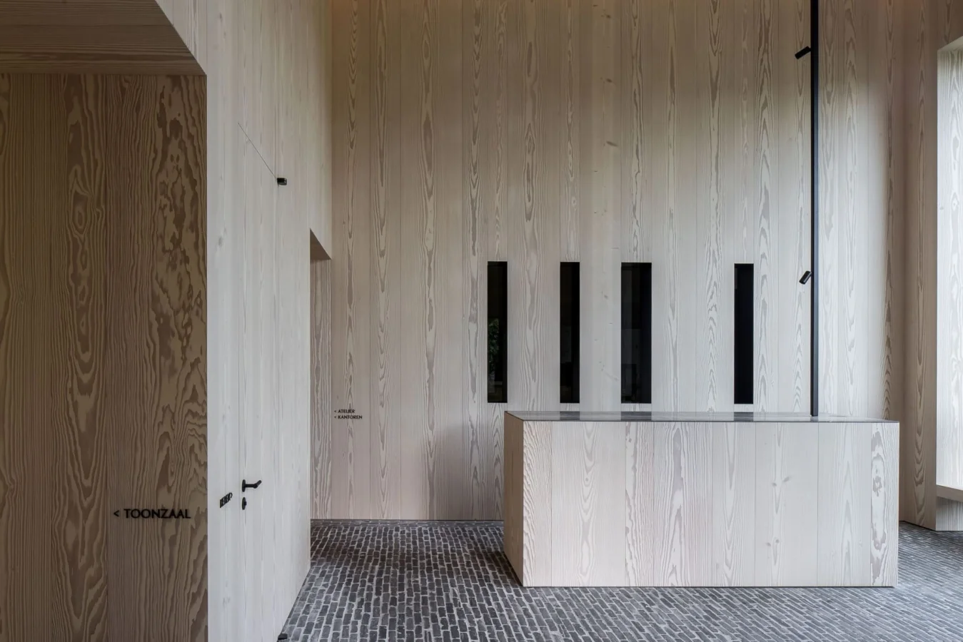 Russwood Douglas Fir Flooring prefinished in Signature White in a modern house with an island.