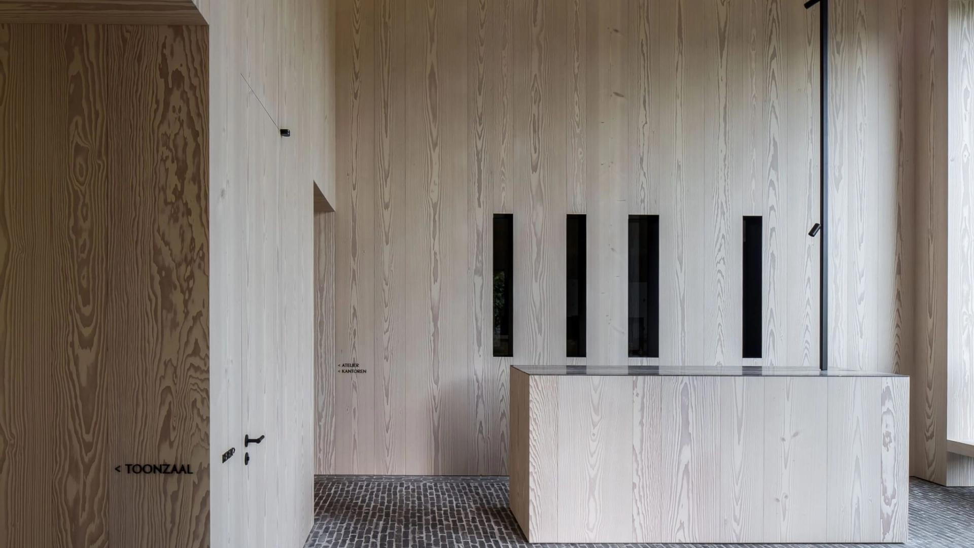 Russwood Douglas Fir Flooring prefinished in Signature White in a modern house with an island.