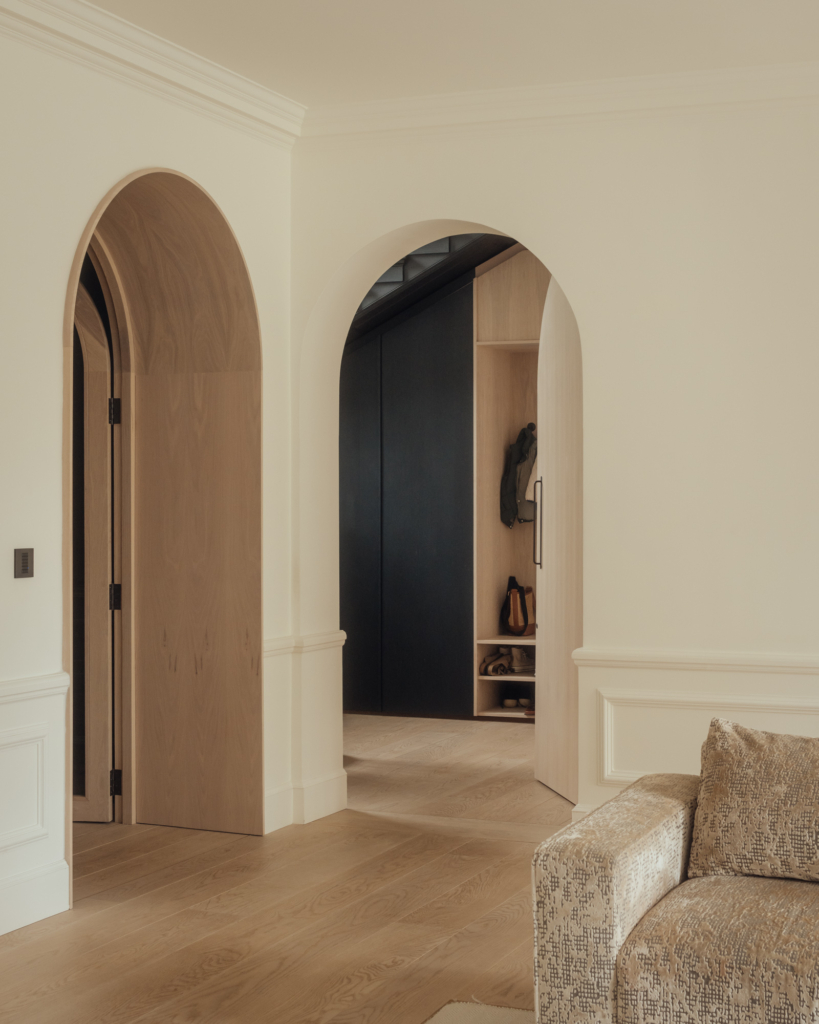 Archway detailiing and oak floor in a home in Edinburgh