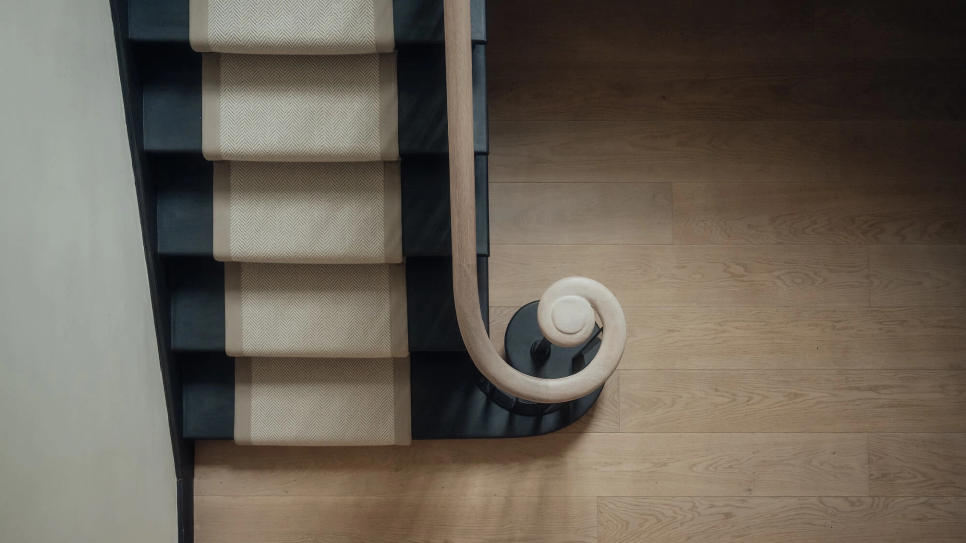 Birds eye shot featuring Russwood oak flooring and a stair runner