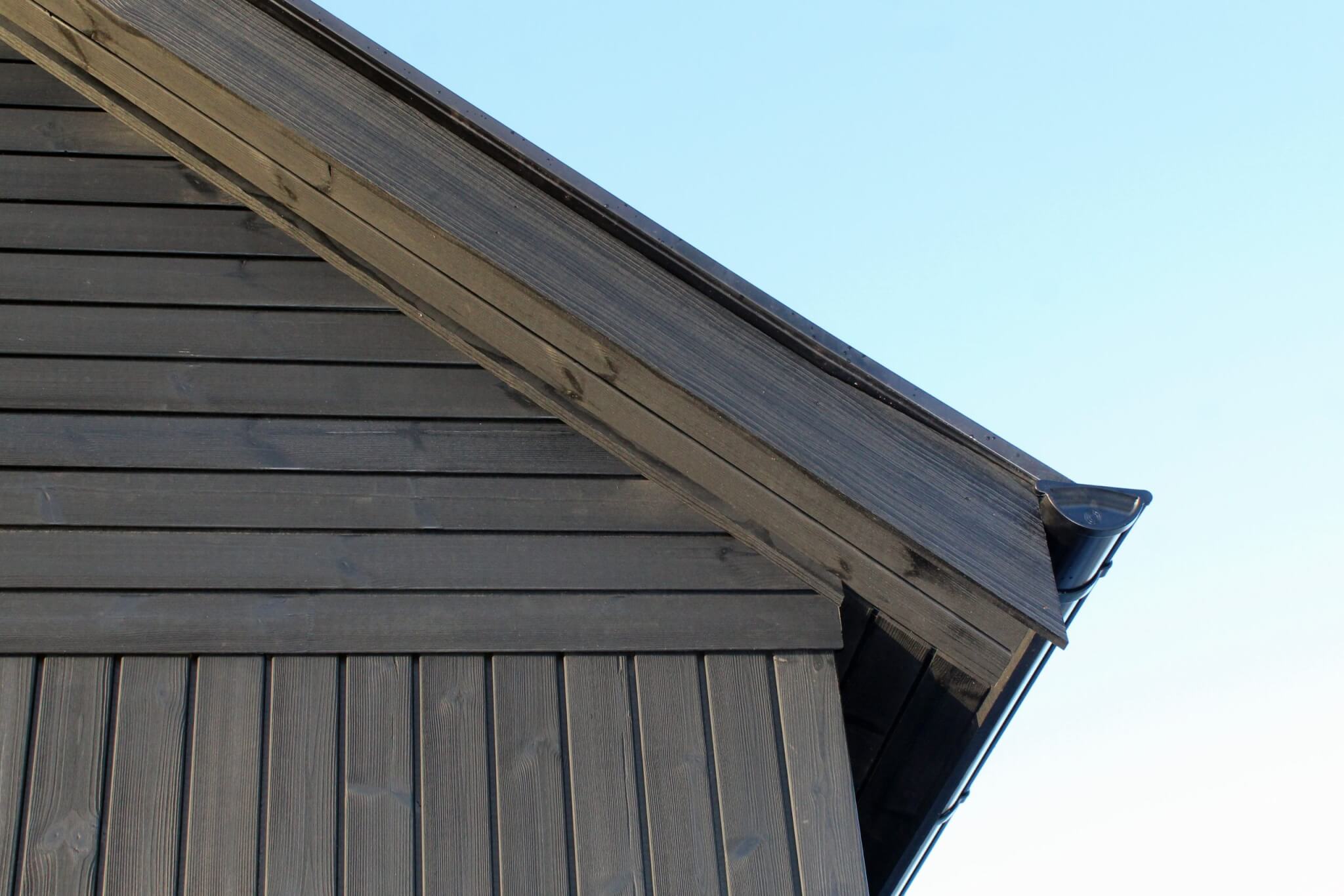 Thermopine® cladding factory coated with Woca Oil in Black