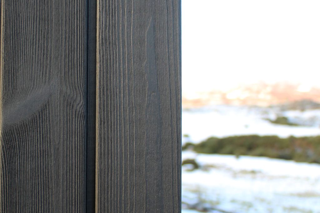 Thermopine® cladding factory coated with Woca Oil in Black