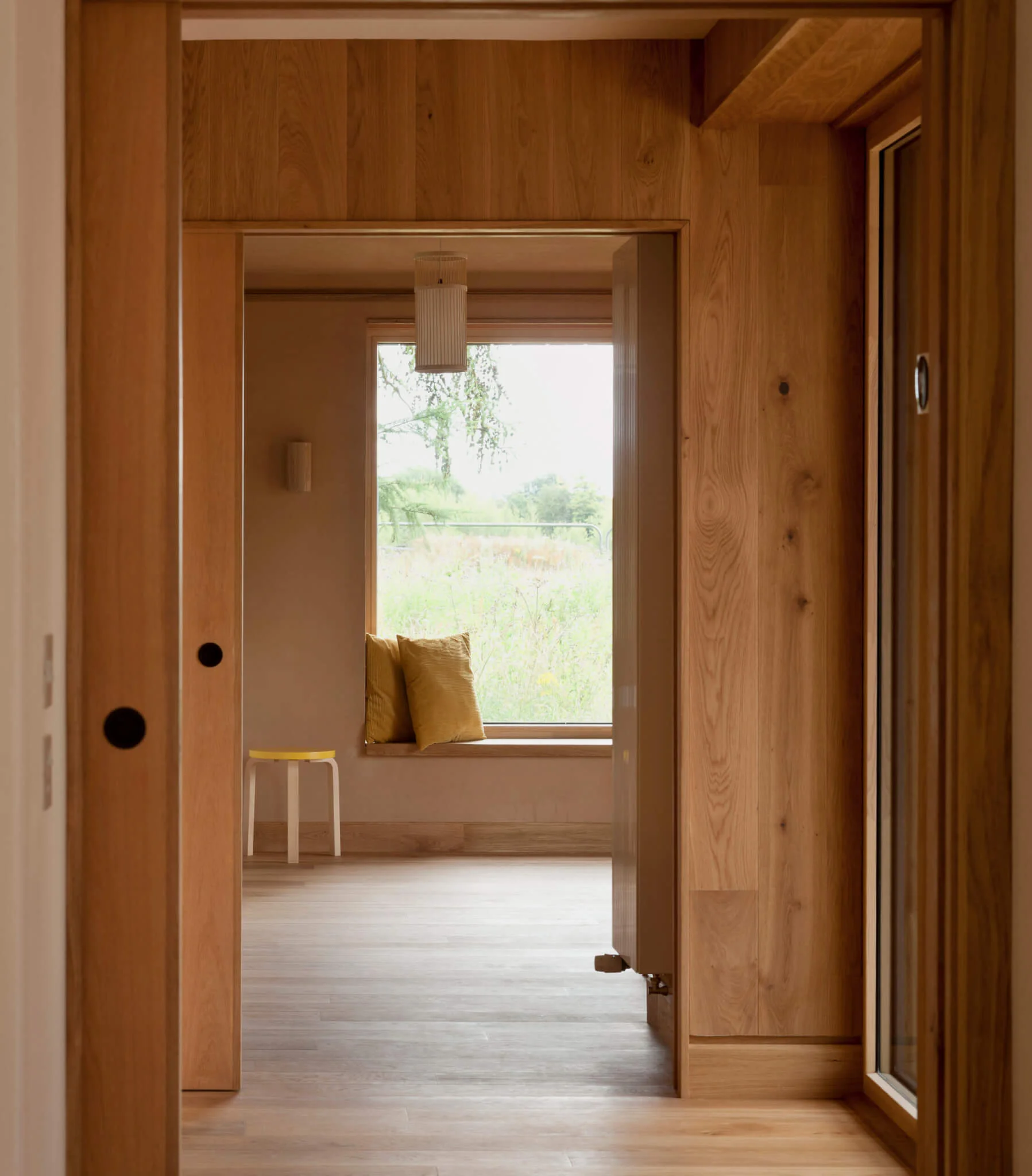 Russwood European Oak Flooring in Sand used as interior cladding and flooring in the Seed project by Kirsty Maguire Architect