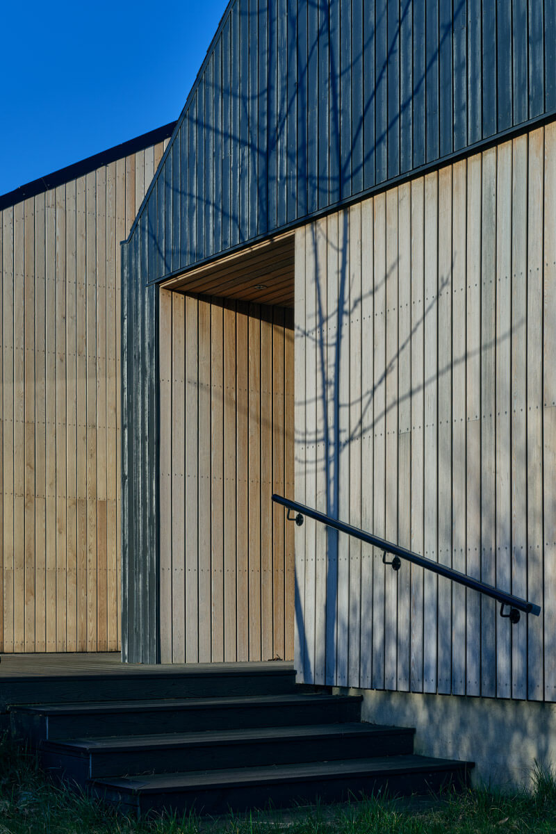 Private home pictured featuring two tone timber cladding.