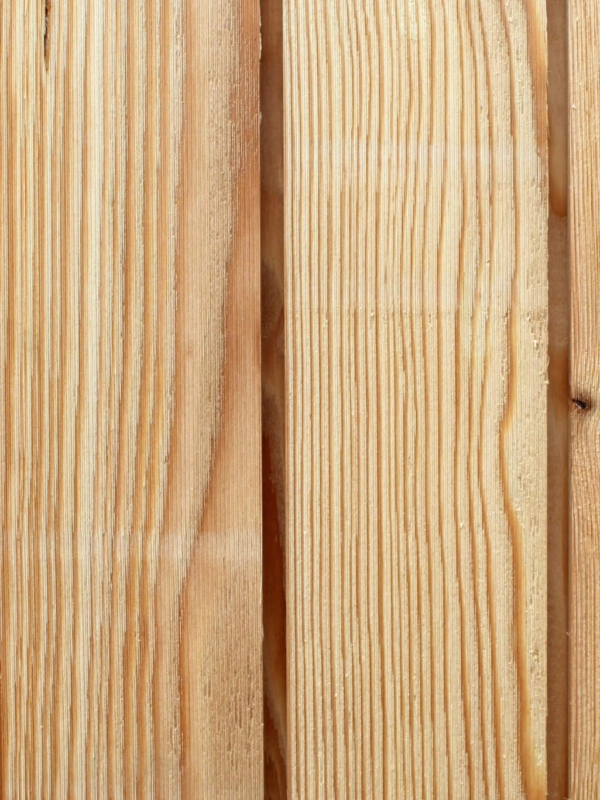 Close up of Architect Select larch cladding showing a Microtext surface finish