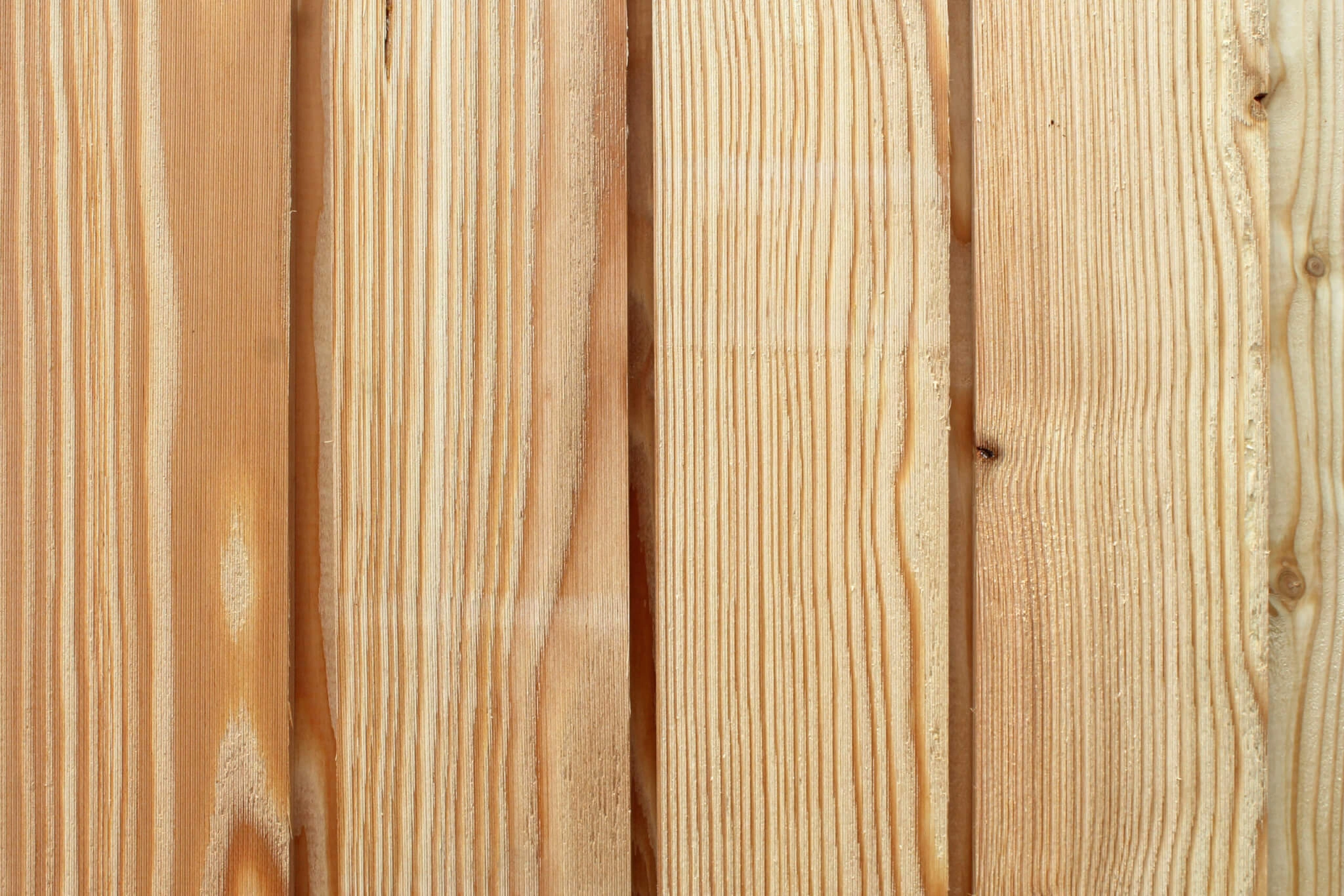 Close up of Architect Select larch cladding showing a Microtext surface finish