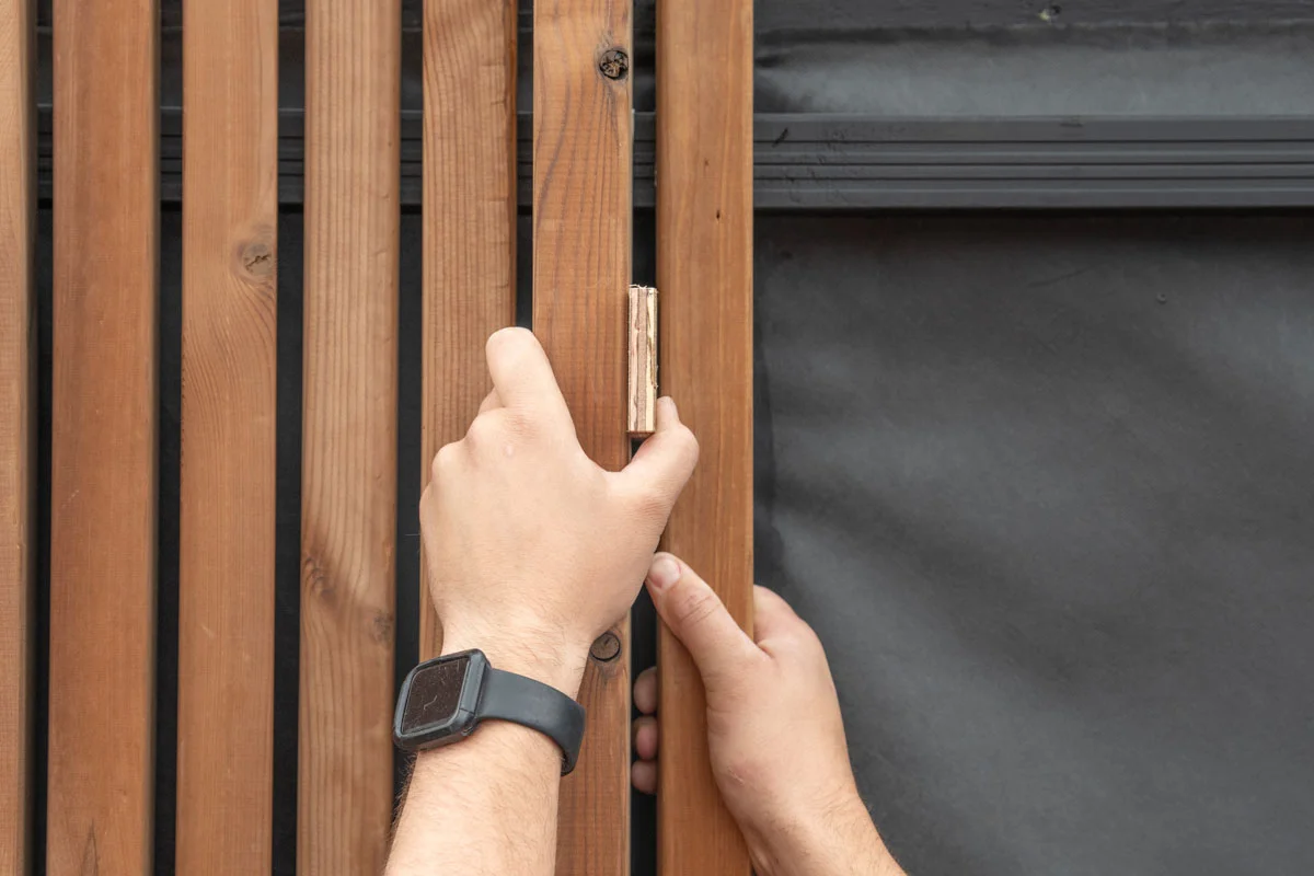 A builder installing timber using Russwood FinFix®.