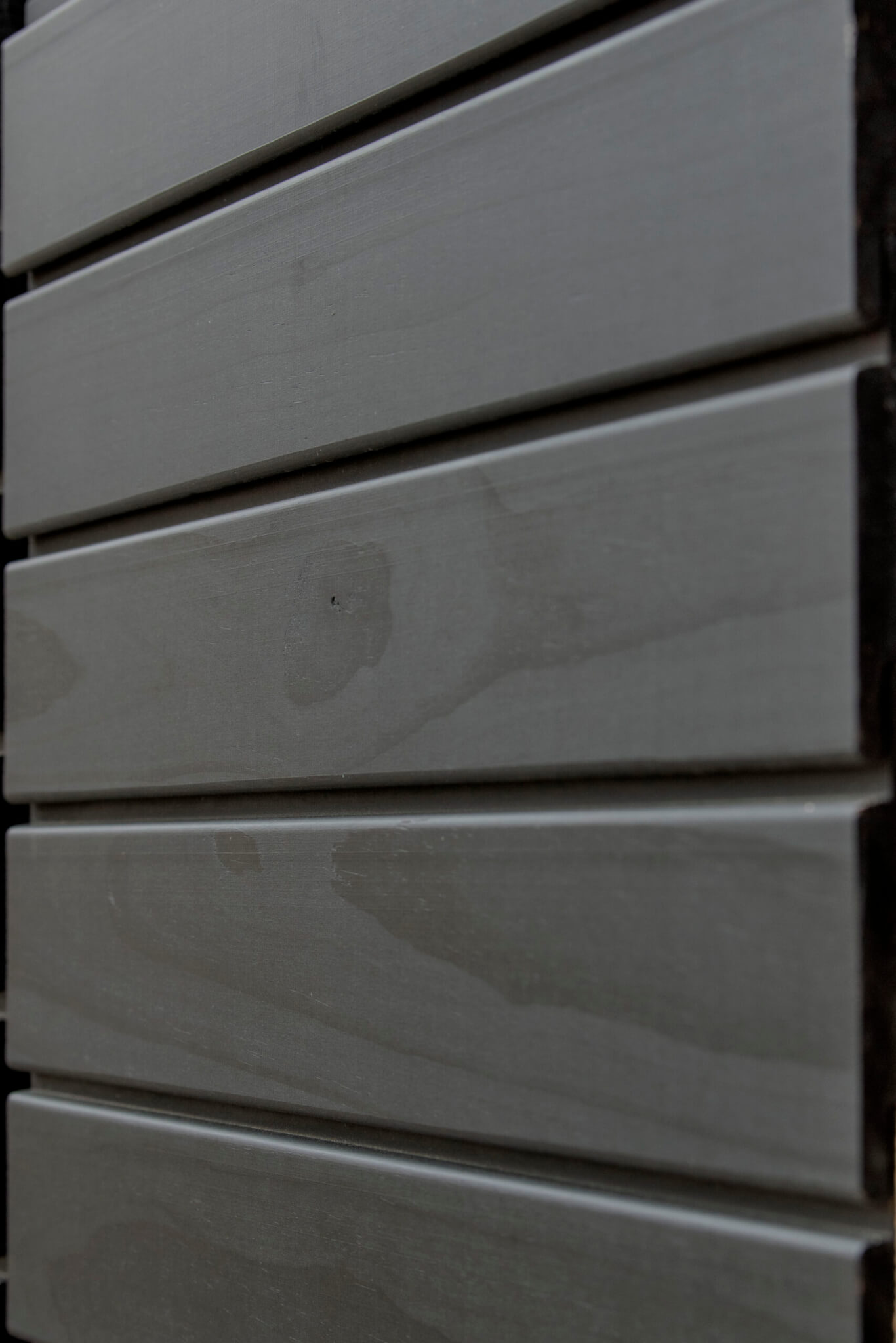 Imbue™ cladding coated in Black oil
