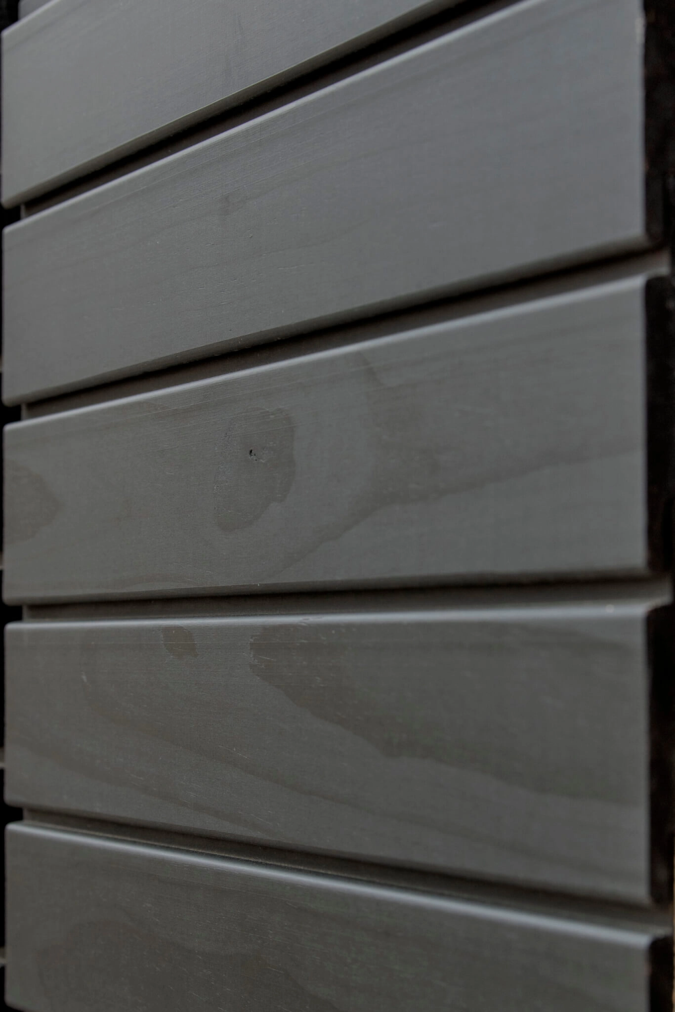 Imbue™ cladding coated in Black oil