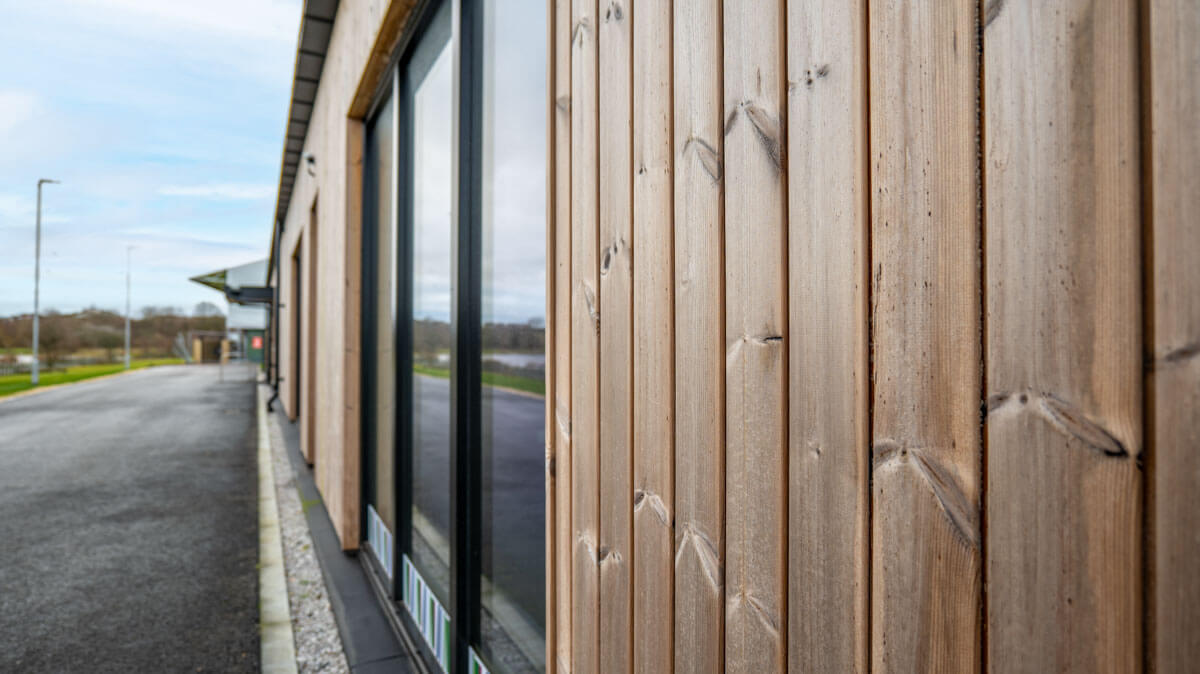 Timber clad building that meets fire performance regulations as it has been treated with Burnblock.