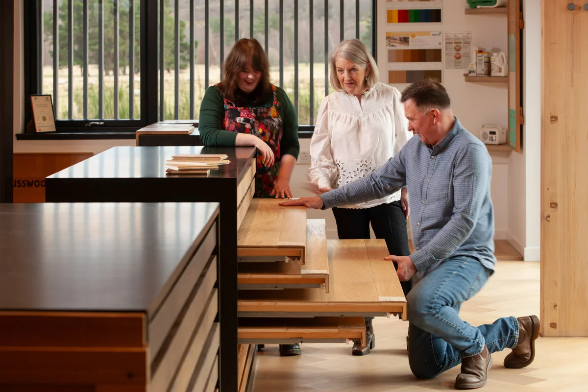 Russwood staff with customers in the wood flooring showroom