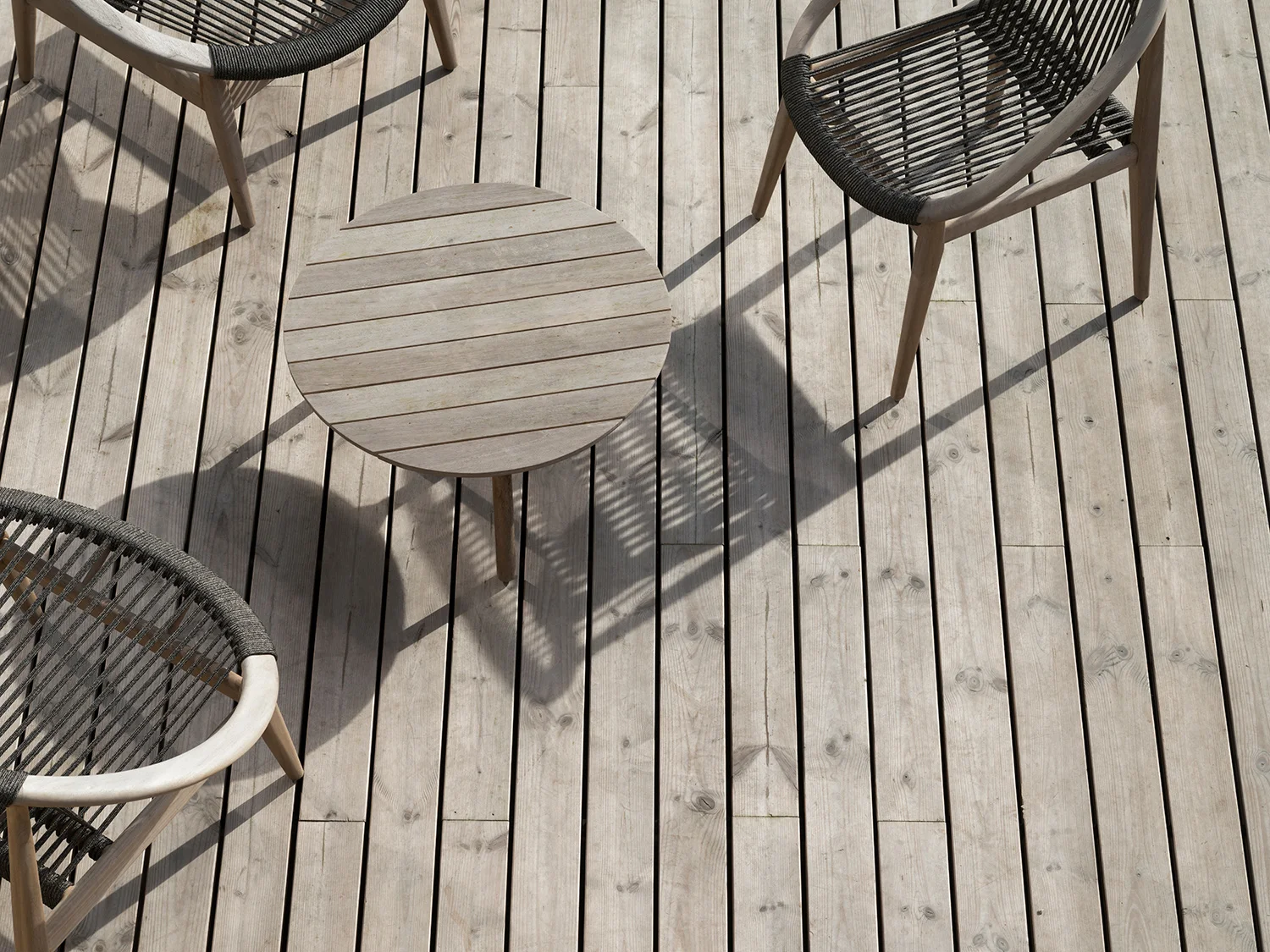 A close up of Russwood's Thermopine decking products weathered to grey